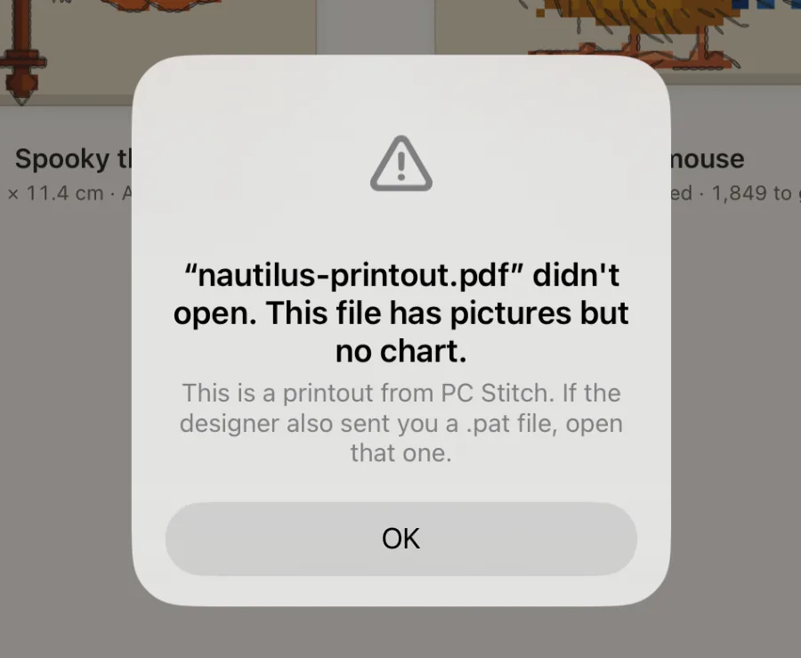 Una scheda sullo scaffale che dice che un file non si è aperto e perché, con un pulsante «Send it to us».